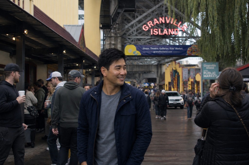 Marcus Chen smiling, outdoors at Granville Island Public Market in Vancouver